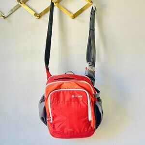 Pacsafe Camsafe V8 Anti-Theft Camera Shoulder Bag in Sunset Red
